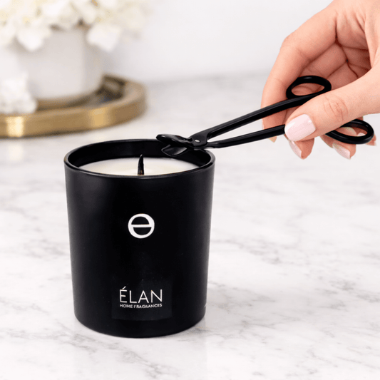 Trimming candle wick before first burn for clean flame