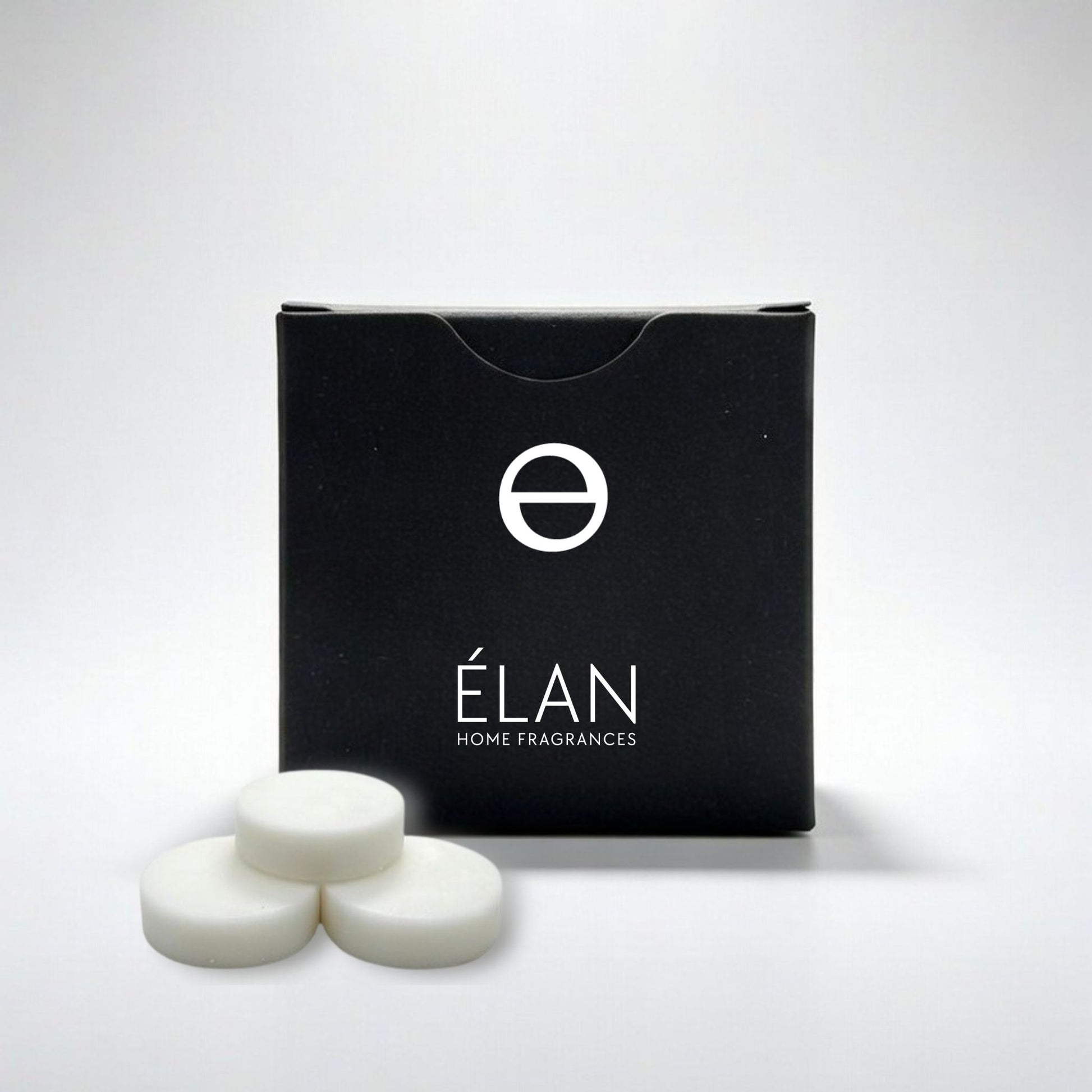 Black box of 3 ÉLAN home fragrances wax melts on a light gray background
